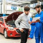 A mechanic explains the repair estimate of a customer's car