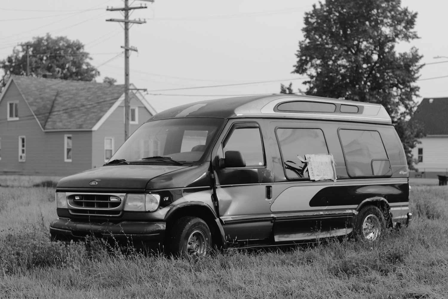 black van after a collision, black and white